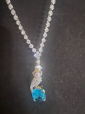 Silver Parrot Pendant Necklace with Blue Gem